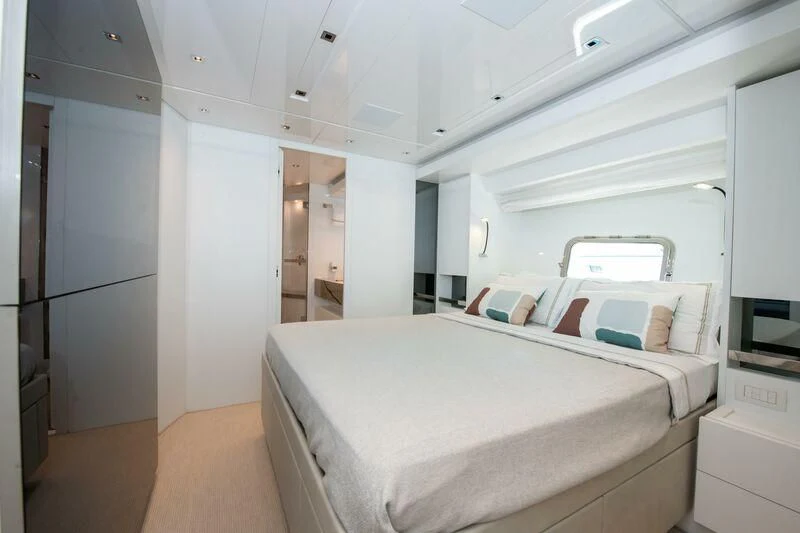 a room with a bed and a desk aboard MARAVI Yacht for Sale