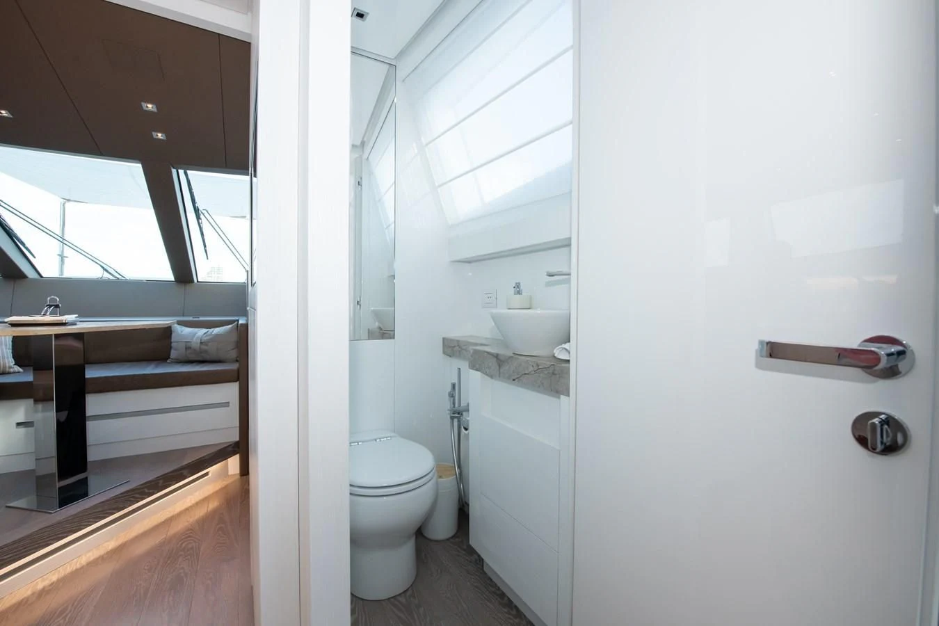 a bathroom with a sink toilet and a mirror aboard MARAVI Yacht for Sale