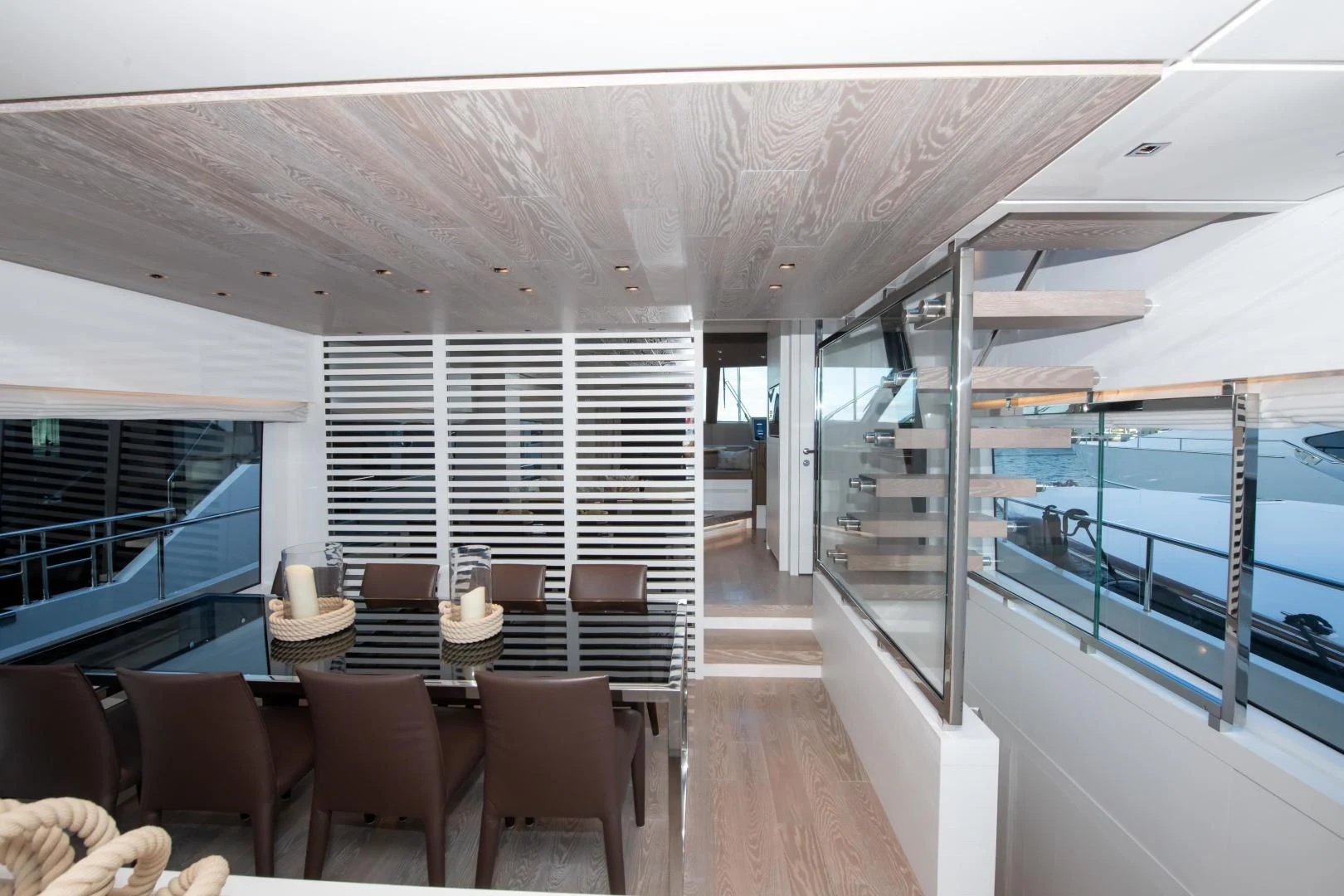 a room with a table chairs and a large window aboard MARAVI Yacht for Sale