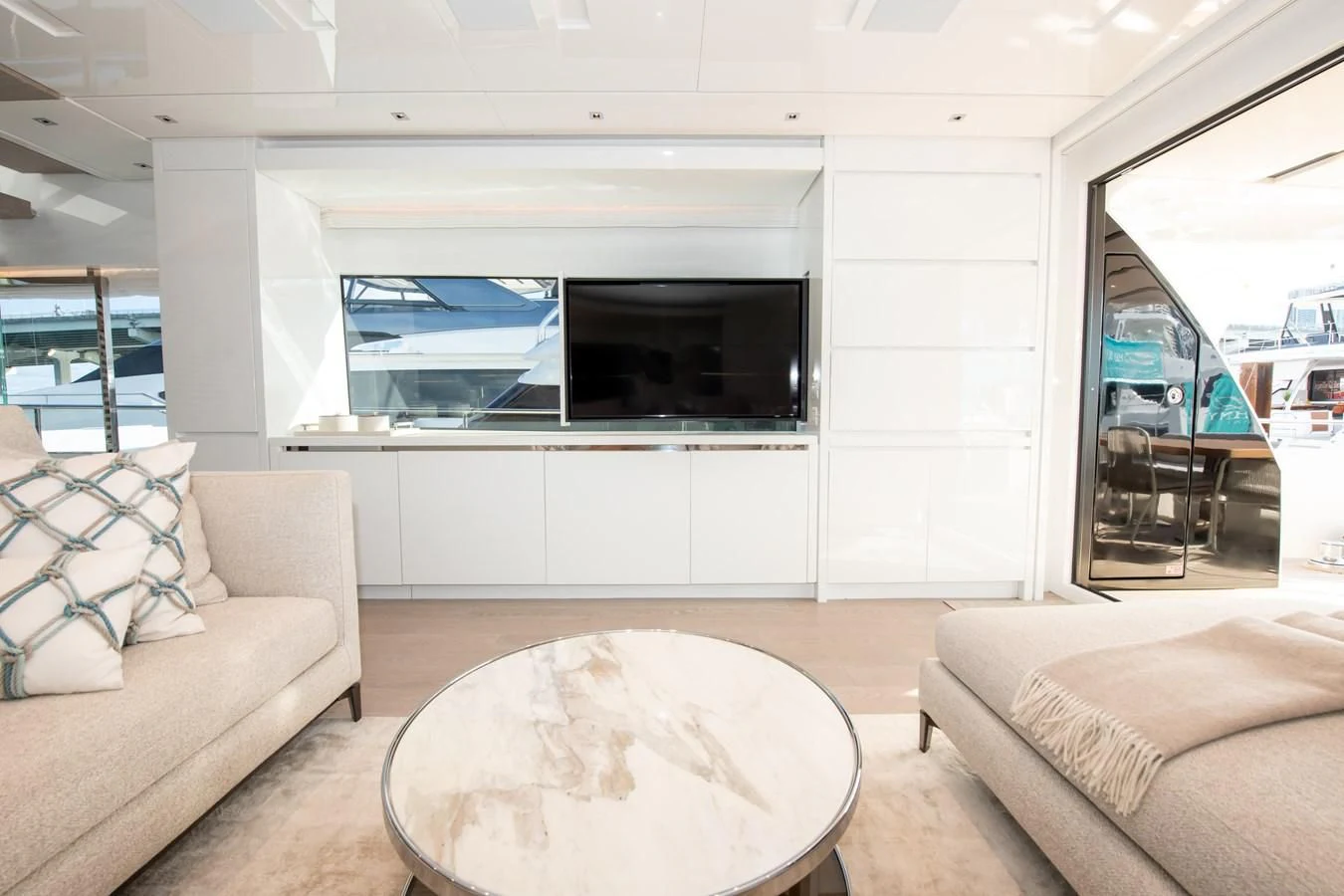 a living room with a couch and a television aboard MARAVI Yacht for Sale