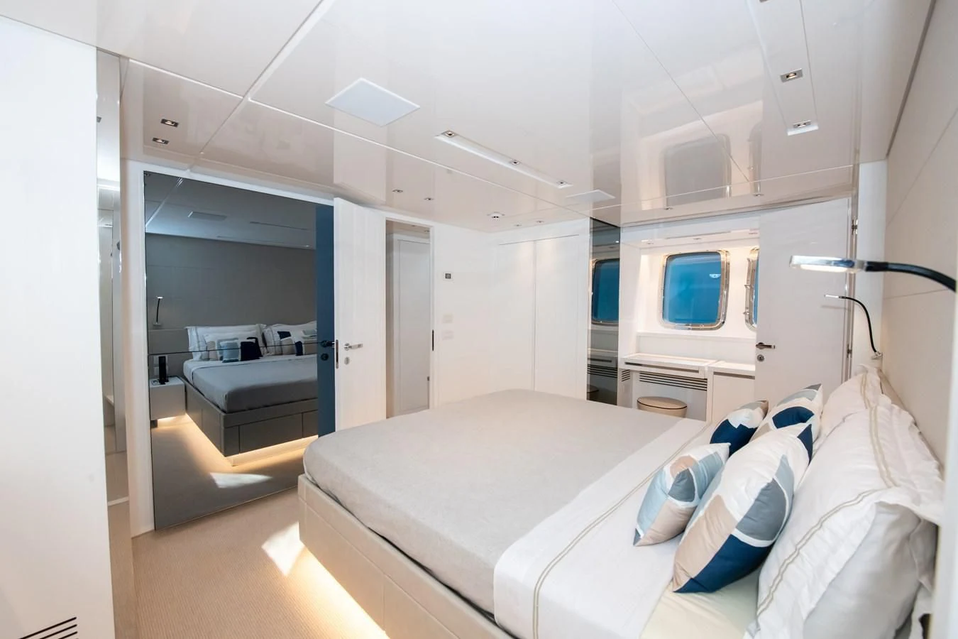 a bedroom with a bed and a desk aboard MARAVI Yacht for Sale