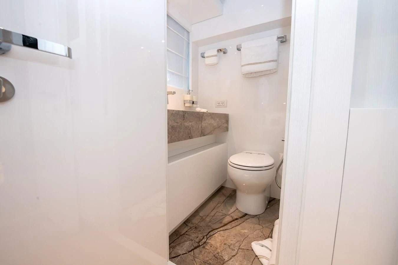 a bathroom with a sink toilet and bathtub aboard MARAVI Yacht for Sale