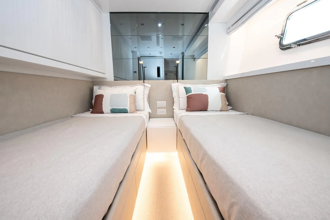 a room with a bed and a mirror aboard MARAVI Yacht for Sale