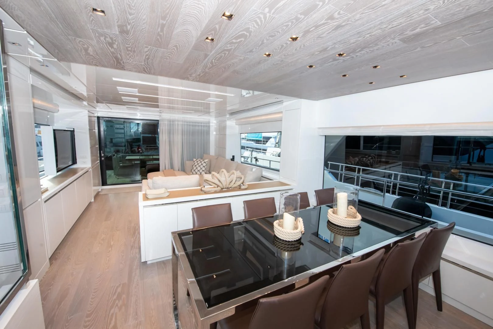 a large living room with a large table and chairs aboard MARAVI Yacht for Sale
