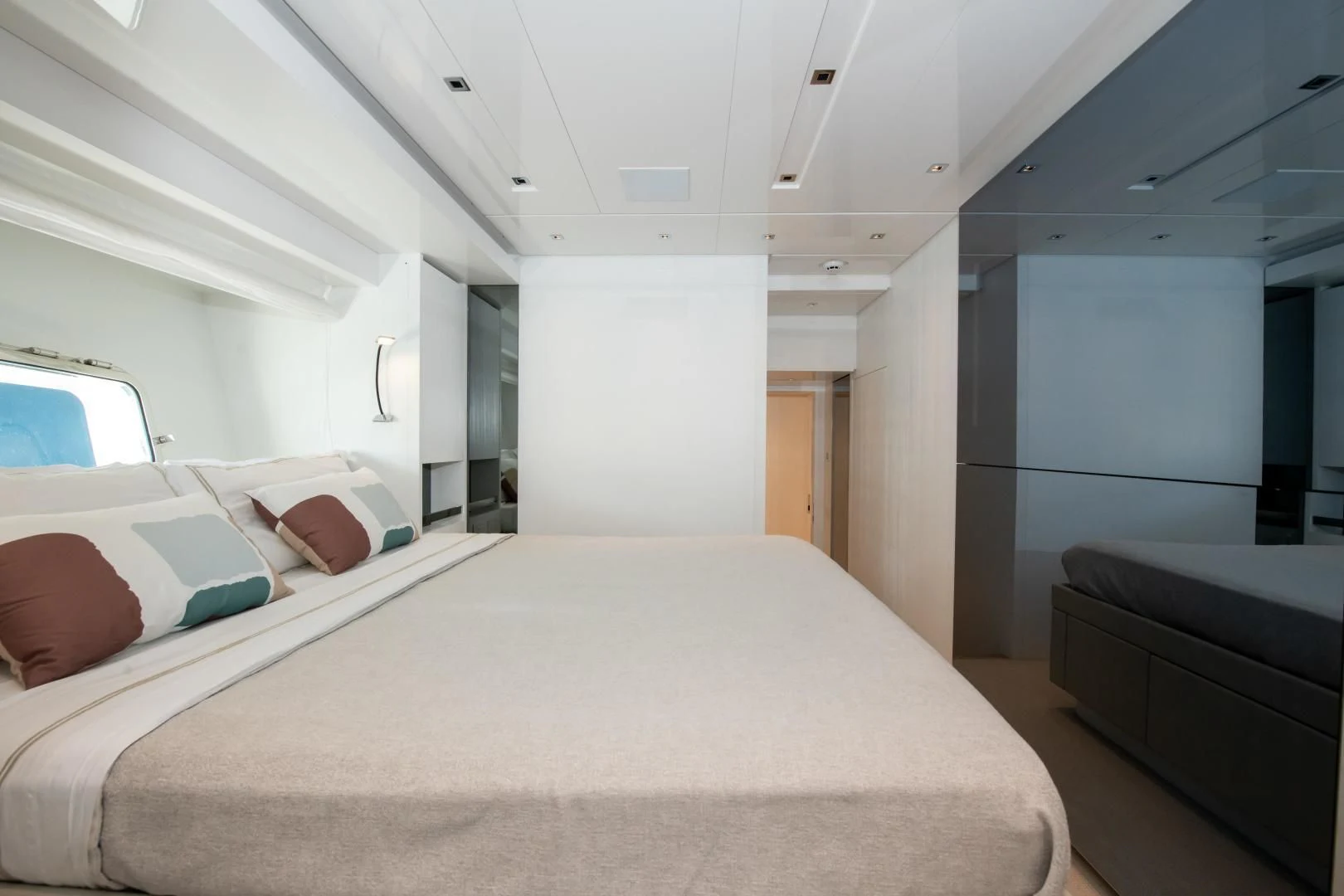 a room with a bed and a couch aboard MARAVI Yacht for Sale