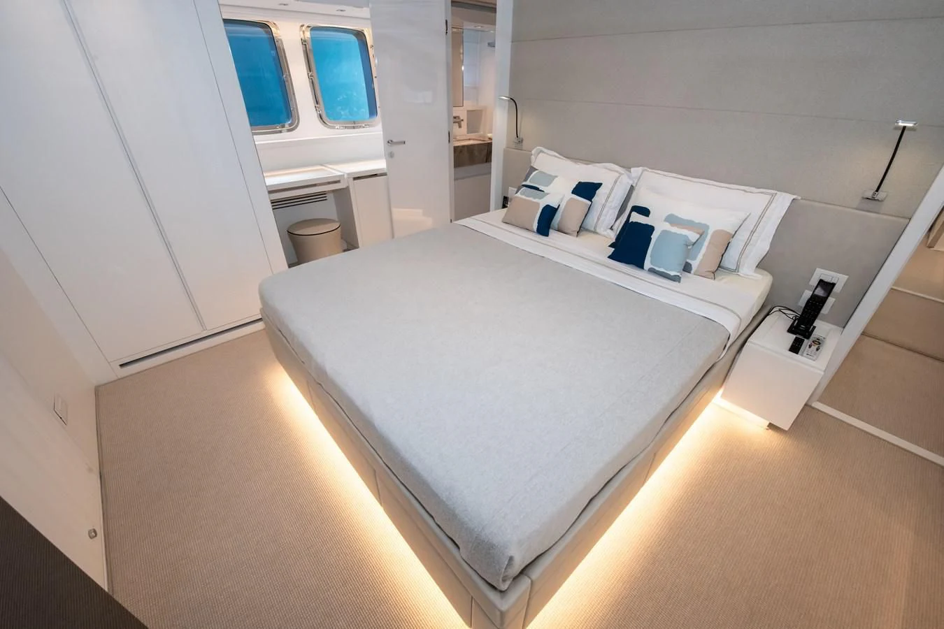 a large white bed in a room aboard MARAVI Yacht for Sale