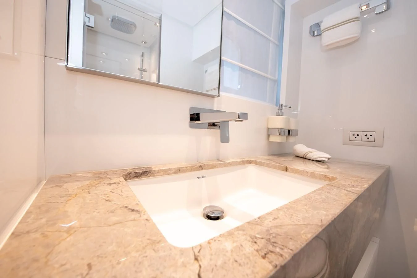 a bathroom with a large mirror aboard MARAVI Yacht for Sale