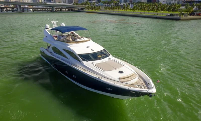 a white boat on the water aboard FINS UP Yacht for Sale