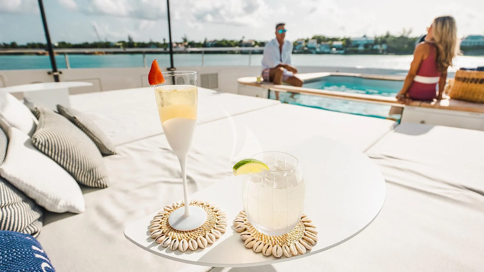 a glass of champagne on a table aboard KOJU Yacht for Sale