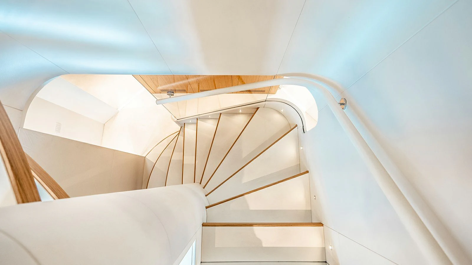 a staircase with a railing aboard KOJU Yacht for Sale