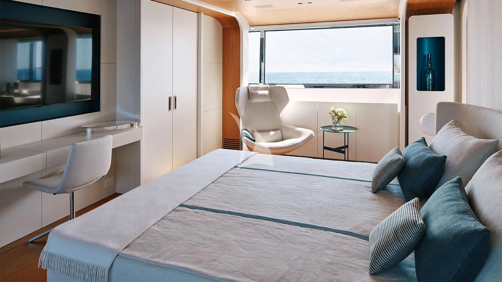 a large bed in a room aboard KOJU Yacht for Sale