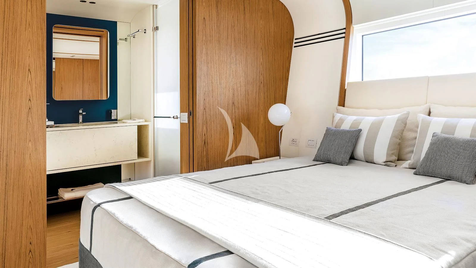 a bed with white sheets aboard KOJU Yacht for Sale