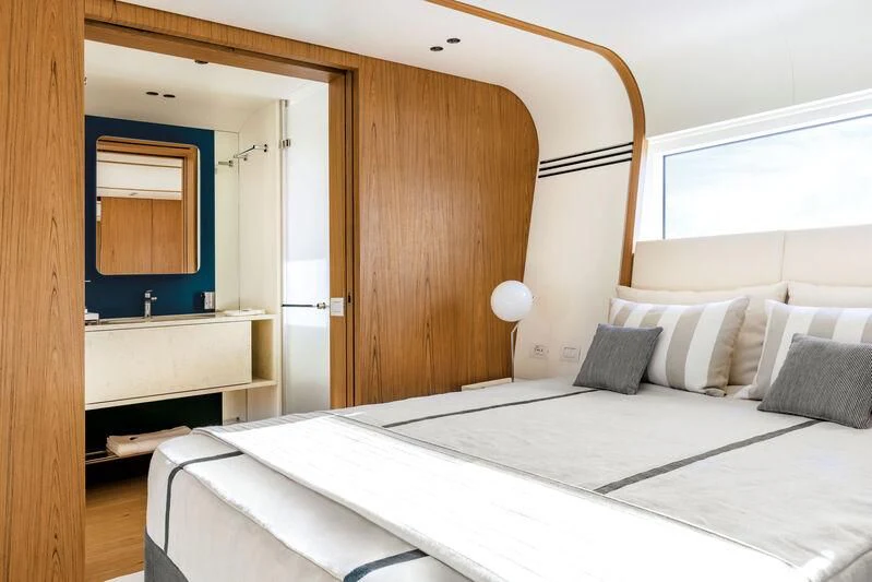 a room with two beds aboard KOJU Yacht for Sale