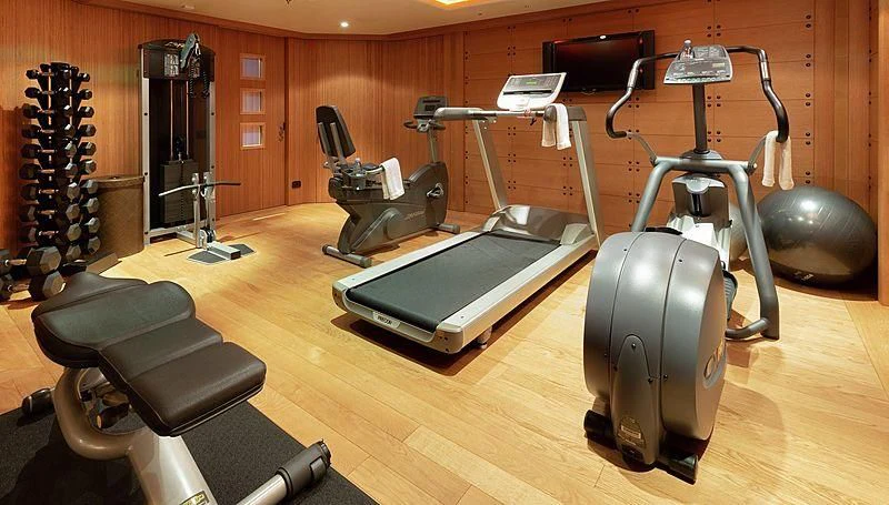 a gym with exercise equipment aboard KOJU Yacht for Sale