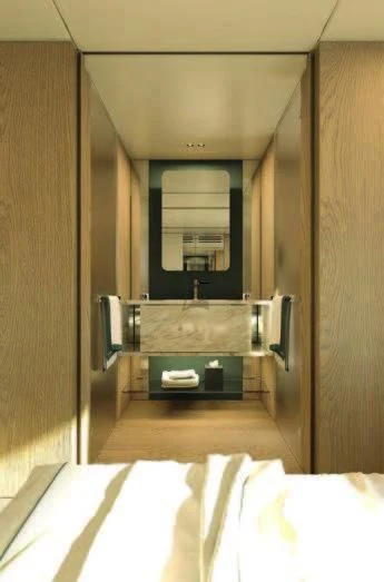 a bathroom with a large mirror aboard KOJU Yacht for Sale