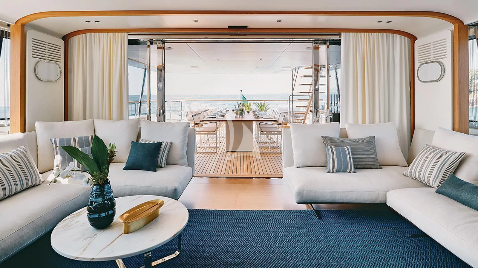 a living room with a couch and a table aboard KOJU Yacht for Sale