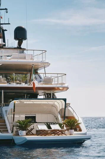 a boat with a plant on the deck aboard KOJU Yacht for Sale