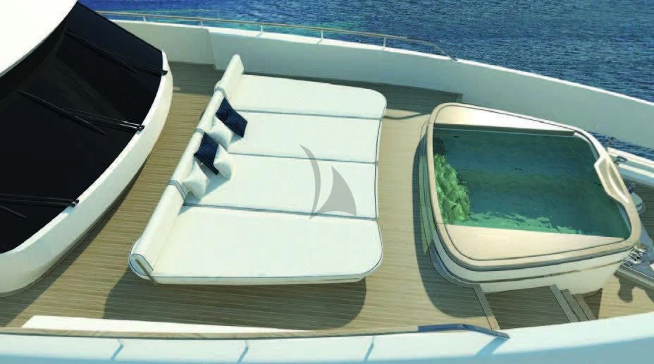 a white and black boat on a wooden dock aboard KOJU Yacht for Sale