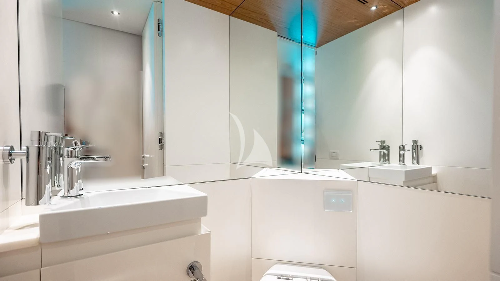 a bathroom with a large mirror aboard KOJU Yacht for Sale