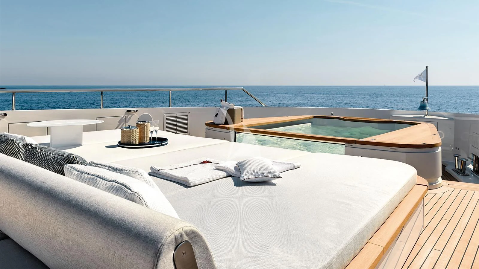 a bed with a tray on it aboard KOJU Yacht for Sale