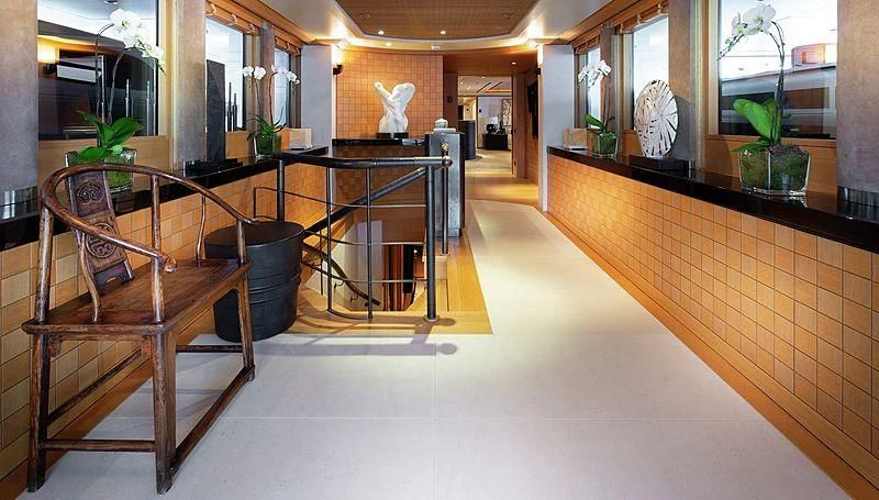 a room with a table and chairs aboard KOJU Yacht for Sale