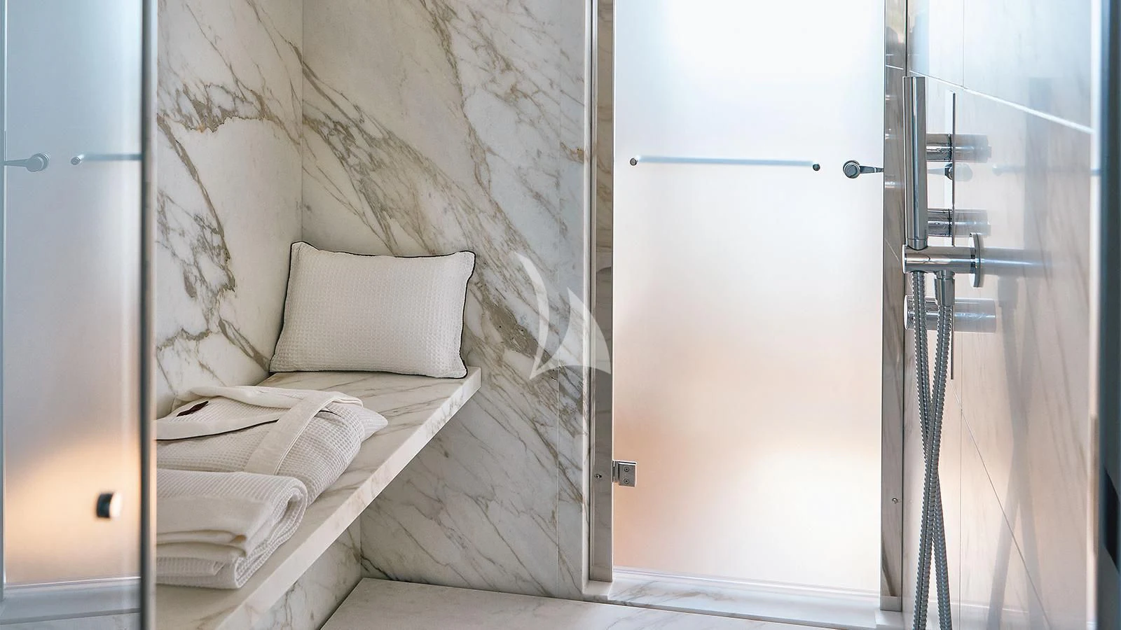 a bed next to a door aboard KOJU Yacht for Sale