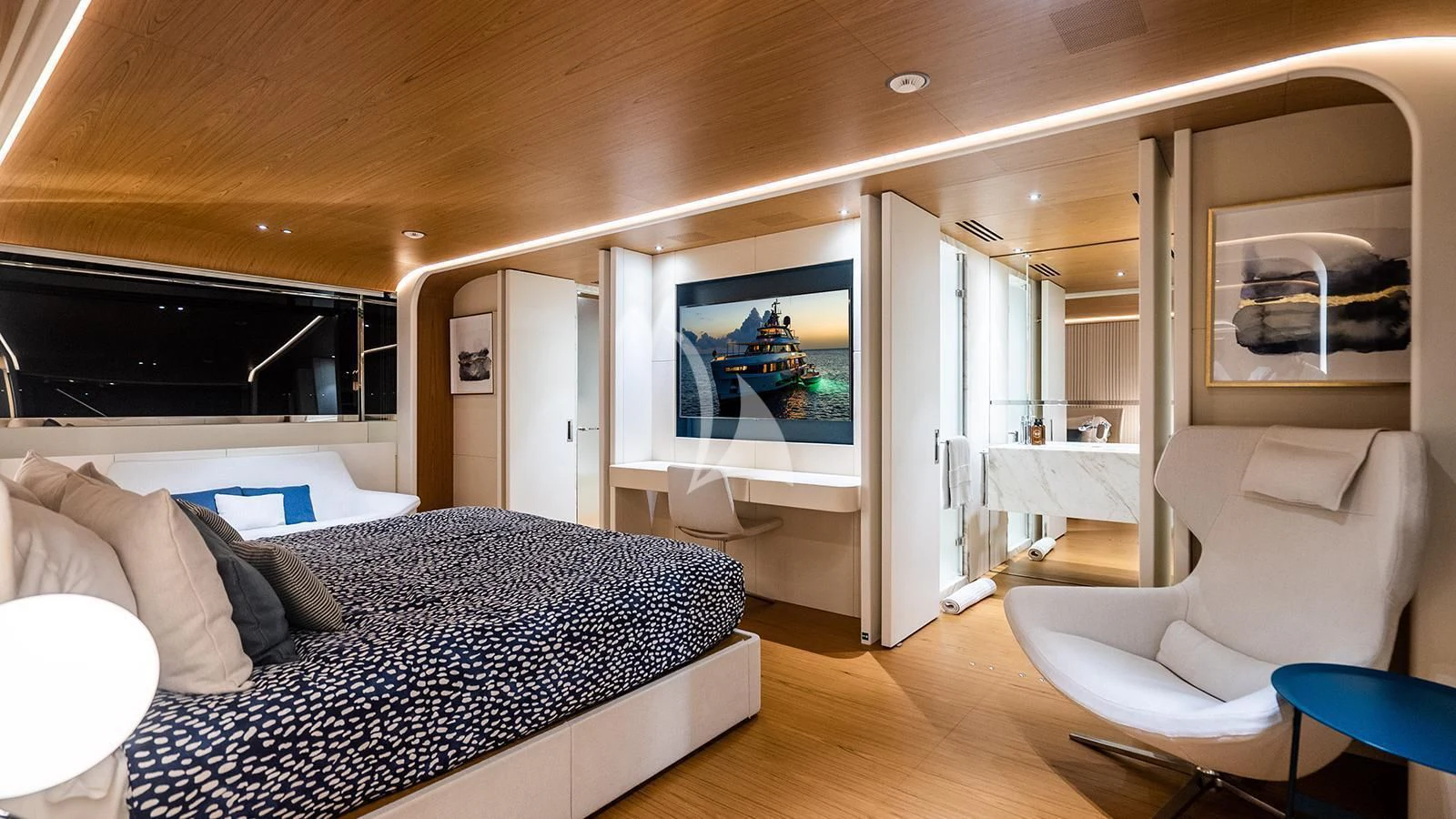 a bedroom with a large bed aboard KOJU Yacht for Sale