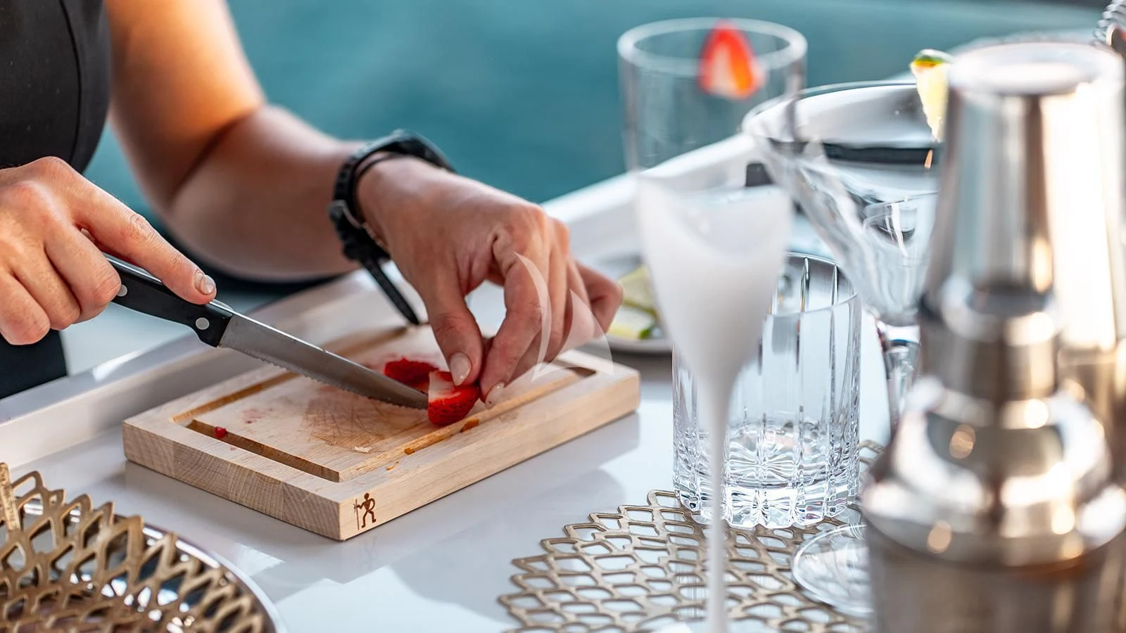 a person cutting a strawberry aboard KOJU Yacht for Sale