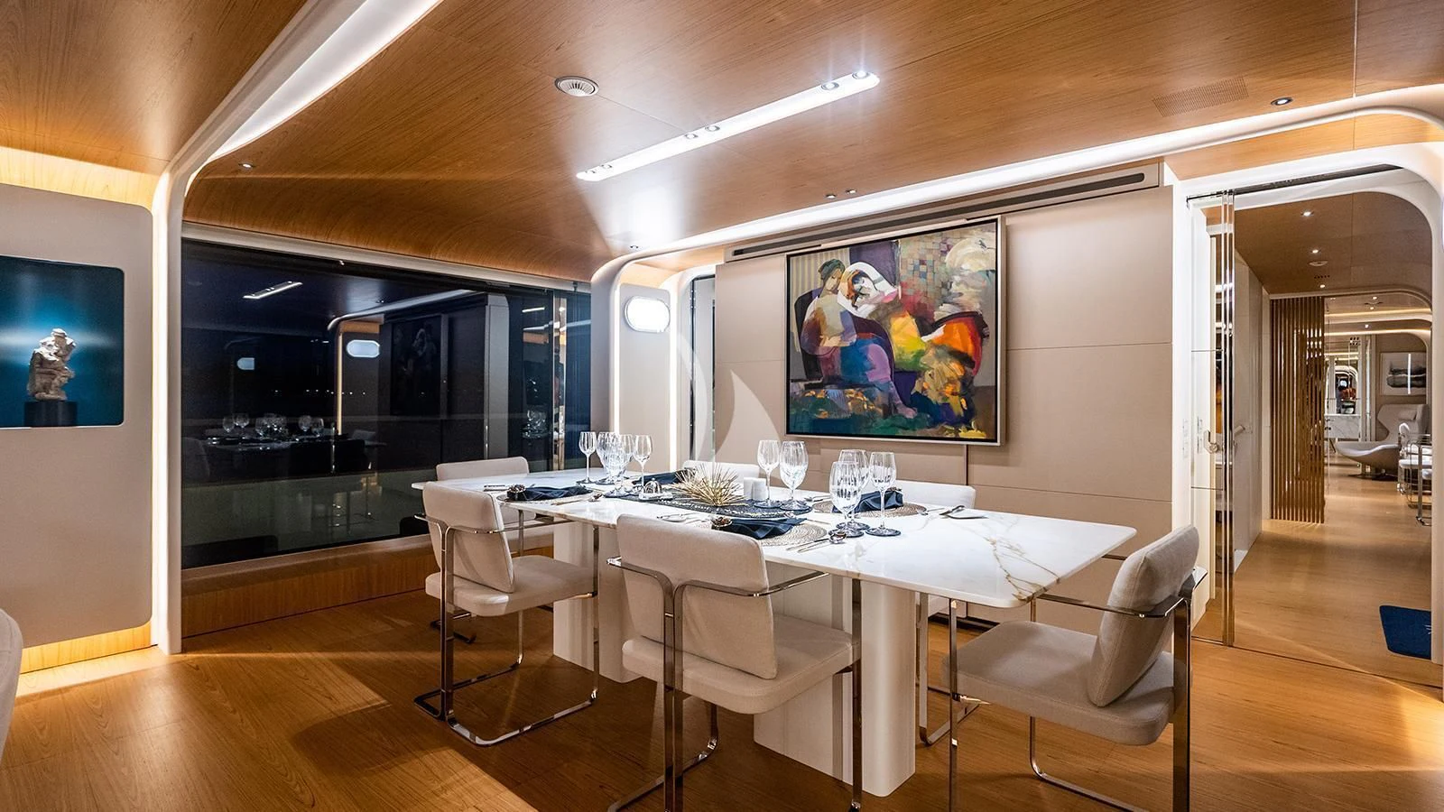 a room with a table and chairs aboard KOJU Yacht for Sale