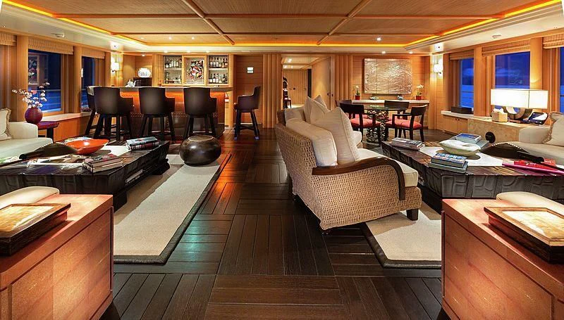 a room with a couch and a table and chairs aboard KOJU Yacht for Sale