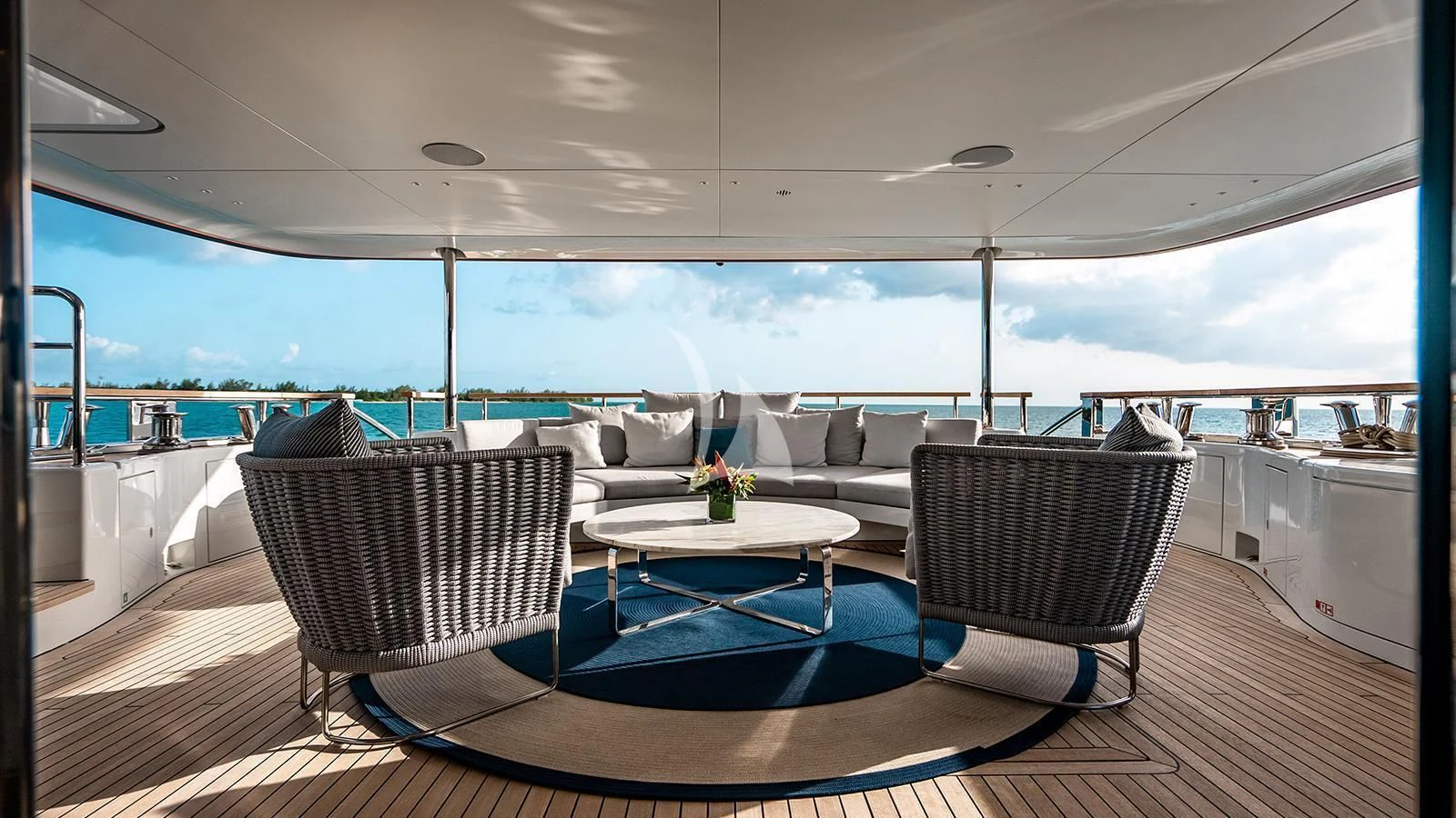 a room with a table and chairs aboard KOJU Yacht for Sale