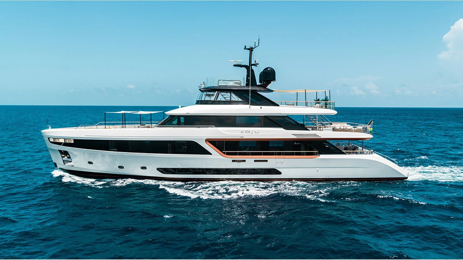 a white yacht in the water aboard KOJU Yacht for Sale