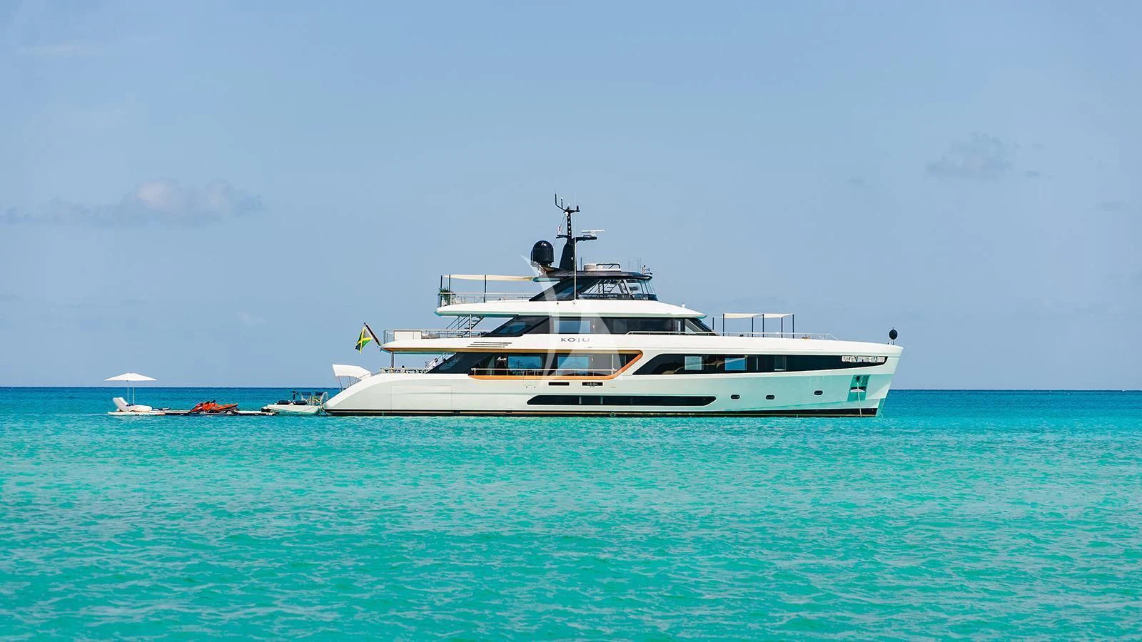 a white boat in the water aboard KOJU Yacht for Sale
