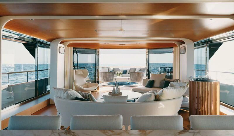a living room with a large window aboard KOJU Yacht for Sale