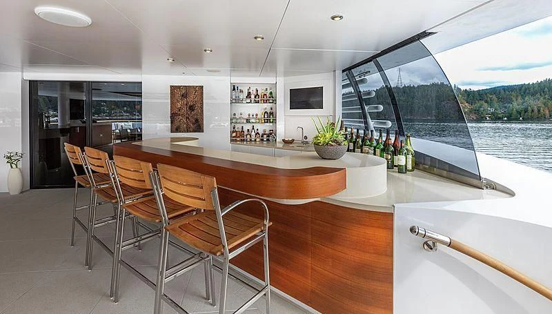 a kitchen with a table and chairs aboard KOJU Yacht for Sale