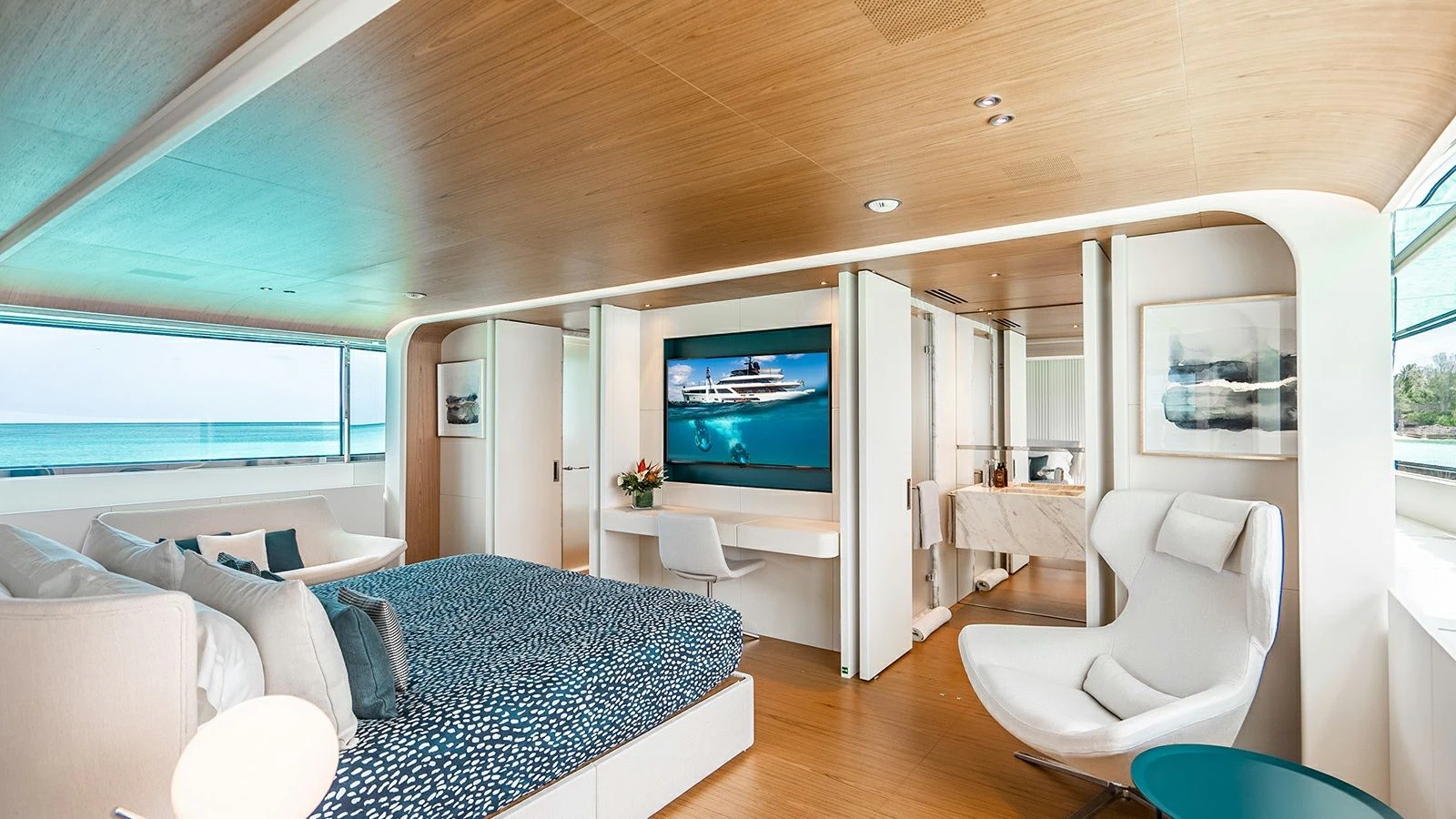 a living room with a large screen aboard KOJU Yacht for Sale