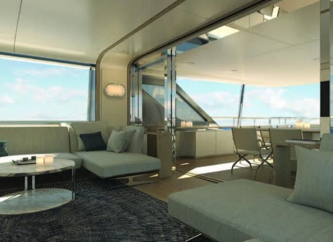 a room with a couch and a table and a large window aboard KOJU Yacht for Sale