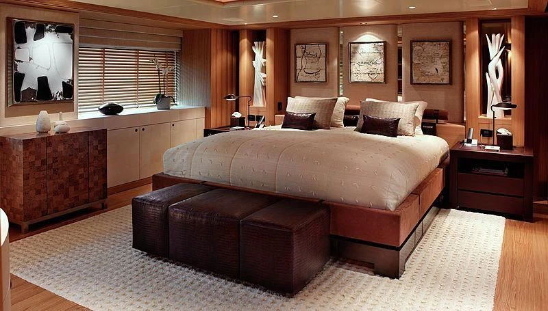 a large bed in a room aboard KOJU Yacht for Sale