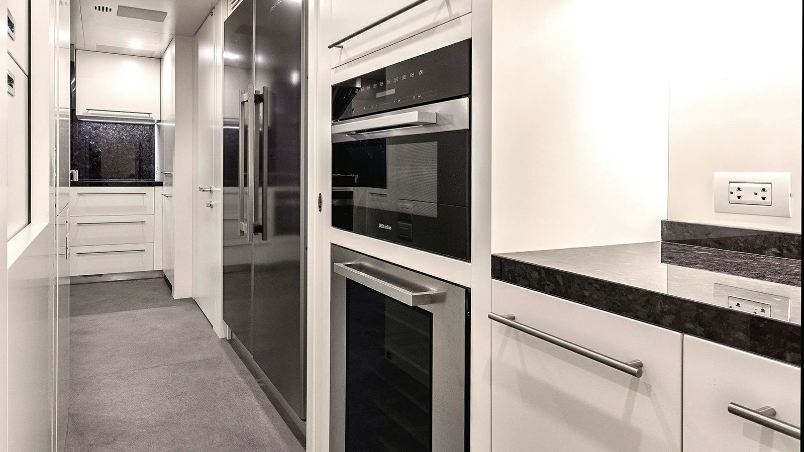a kitchen with a stove and oven aboard KOJU Yacht for Sale