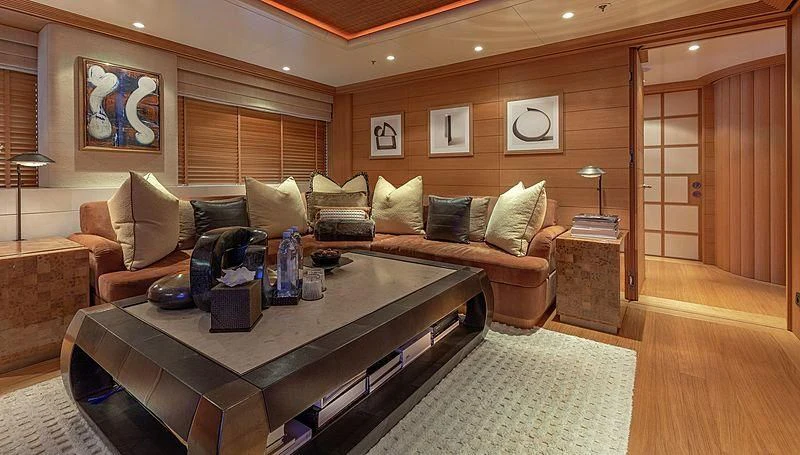 a living room with a coffee table aboard KOJU Yacht for Sale