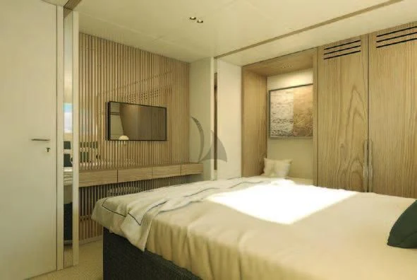 a room with a bed and a television aboard KOJU Yacht for Sale