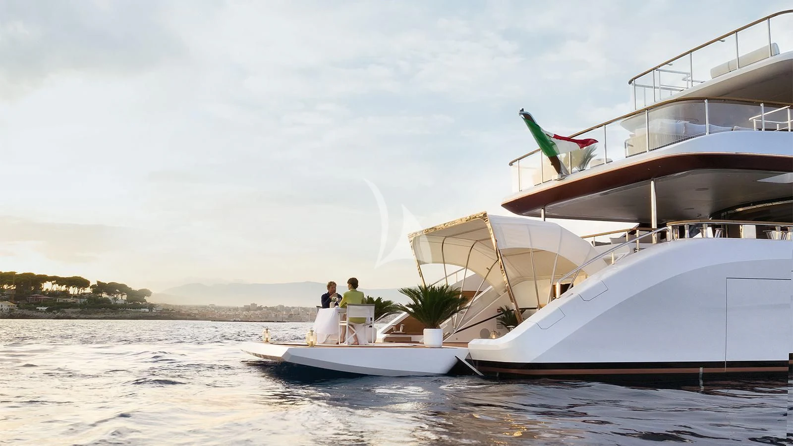 a boat with a flag on it aboard KOJU Yacht for Sale