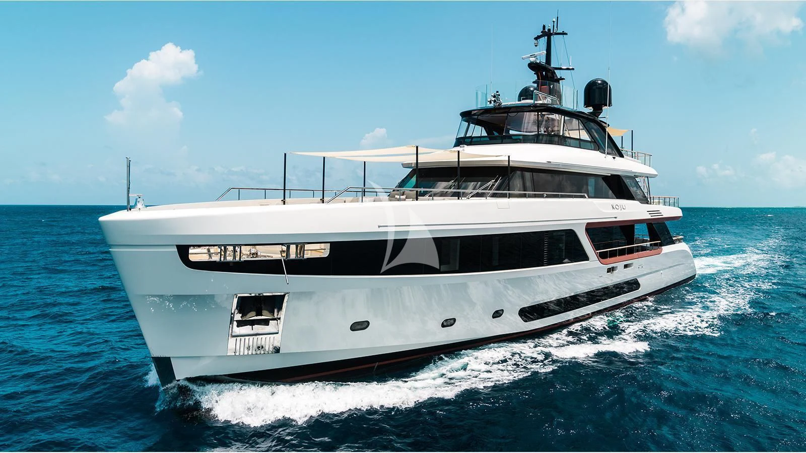 a white yacht on the water aboard KOJU Yacht for Sale