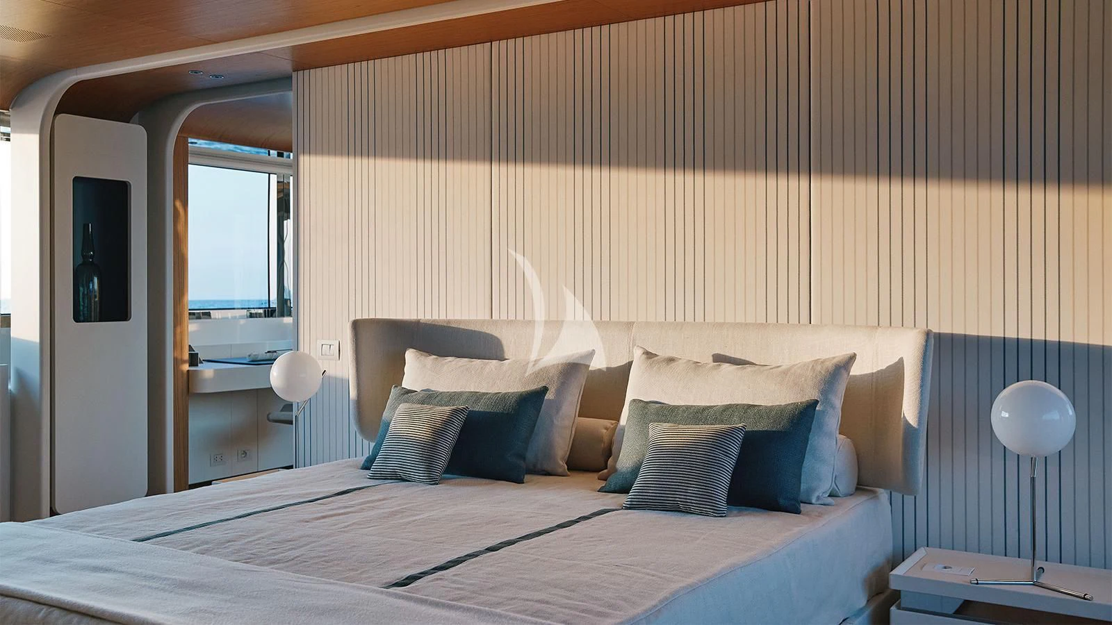a bed with a striped wall aboard KOJU Yacht for Sale