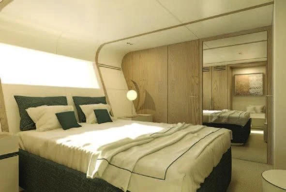 a room with a bed and a desk aboard KOJU Yacht for Sale