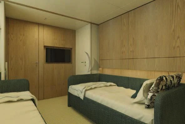 a room with a bed and a television aboard KOJU Yacht for Sale