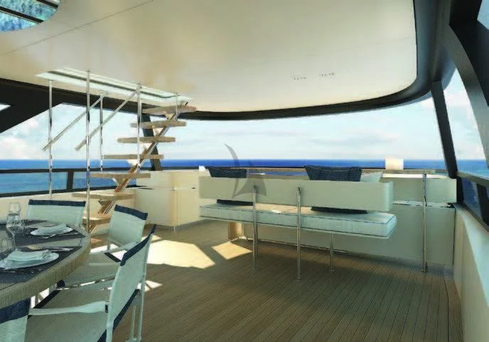 a room with a bed and a table aboard KOJU Yacht for Sale