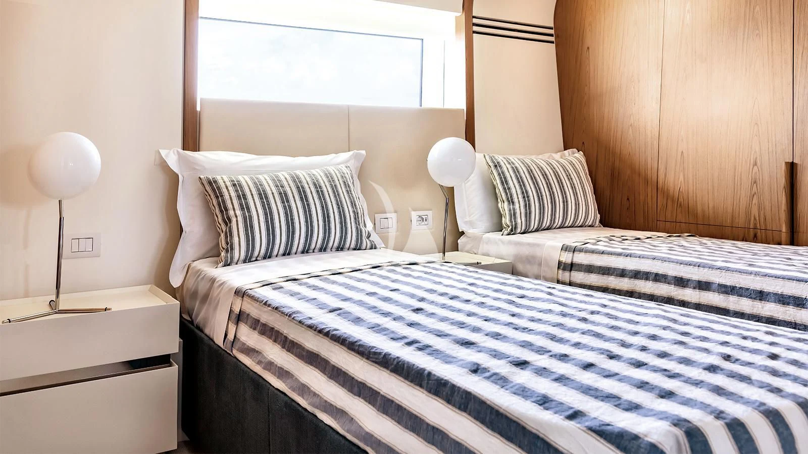 a couple of beds in a room aboard KOJU Yacht for Sale