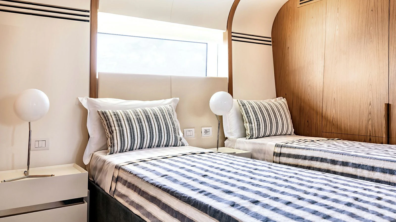 a couple of beds in a room aboard KOJU Yacht for Sale