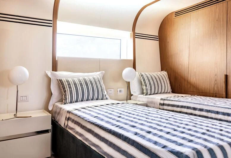 a couple of beds in a room aboard KOJU Yacht for Sale